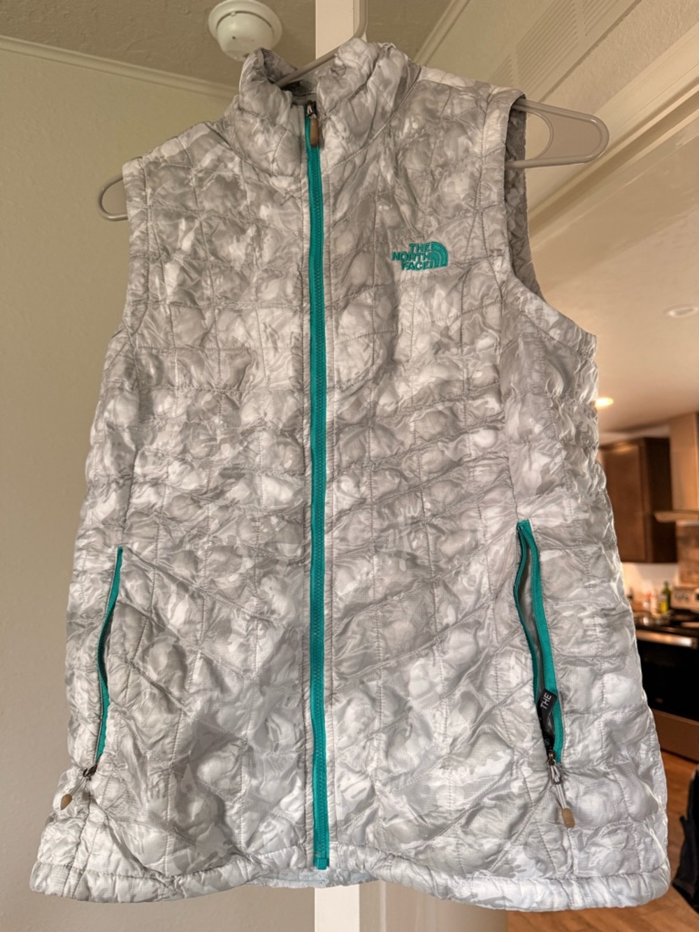 The North Face White Marble Quilted Vest with Teal Zipper